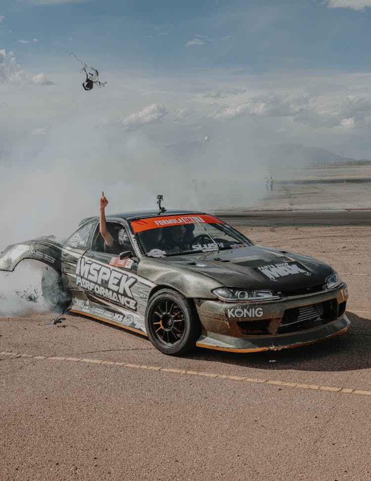 A Nissan Silvia Drifting On A Track