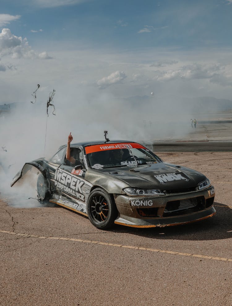 A Nissan Silvia Drifting On A Track