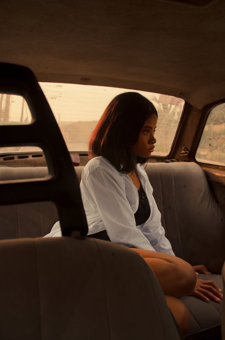 Woman In The Car On The Backseat 