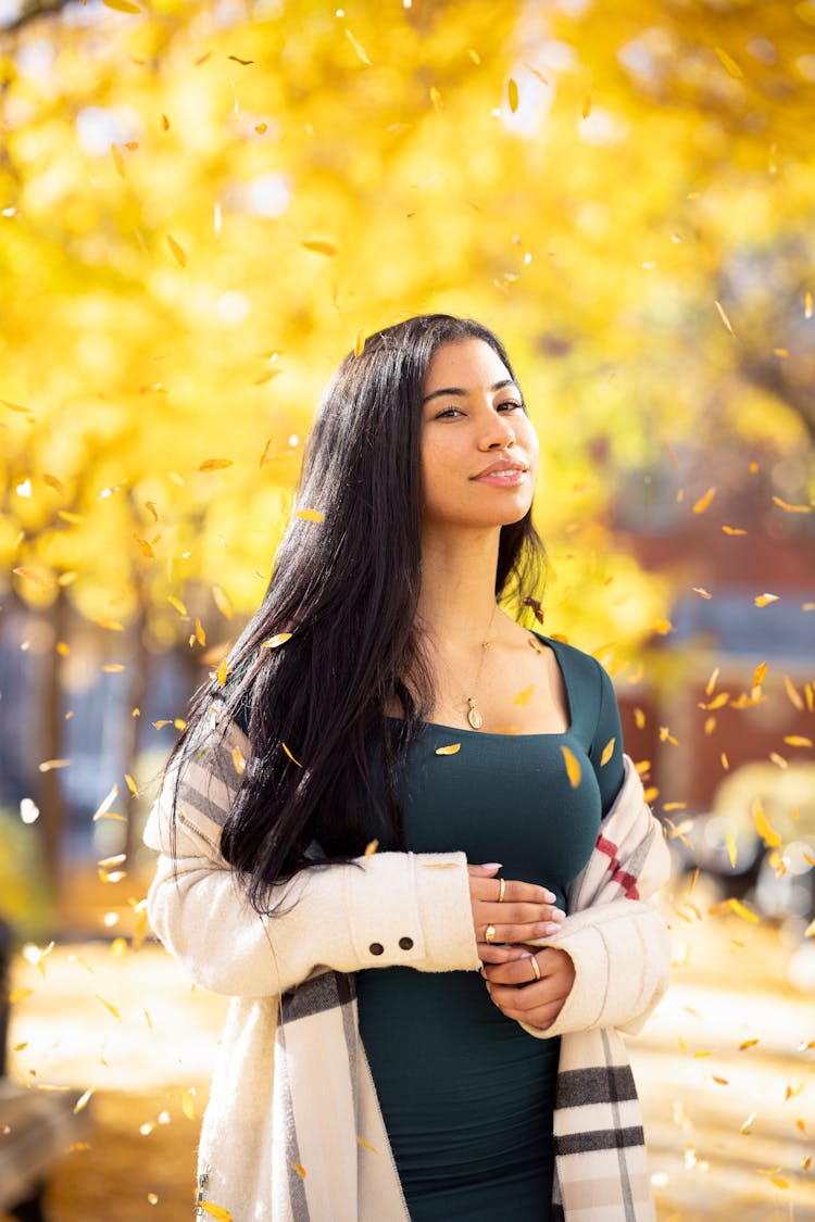 Smiling Woman Among Falling Leaves