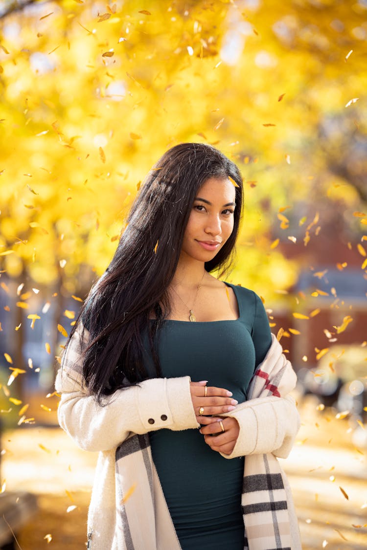 Leaves Falling Around A Smiling Woman