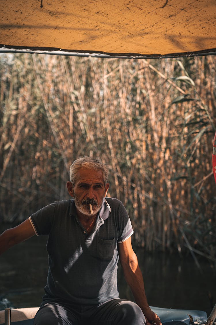 Photo Of Elderly Man Smoking A Cigarette