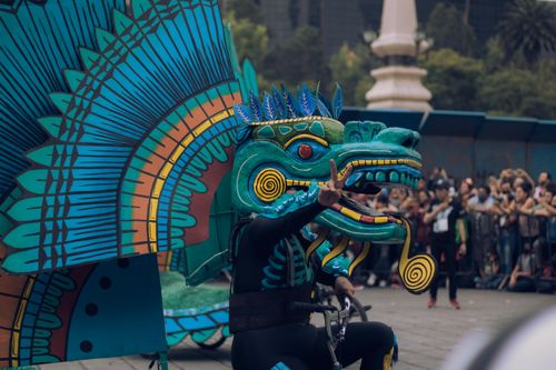 Free Street parade featuring a colorful dragon costume, celebrating cultural traditions outdoors. Stock Photo