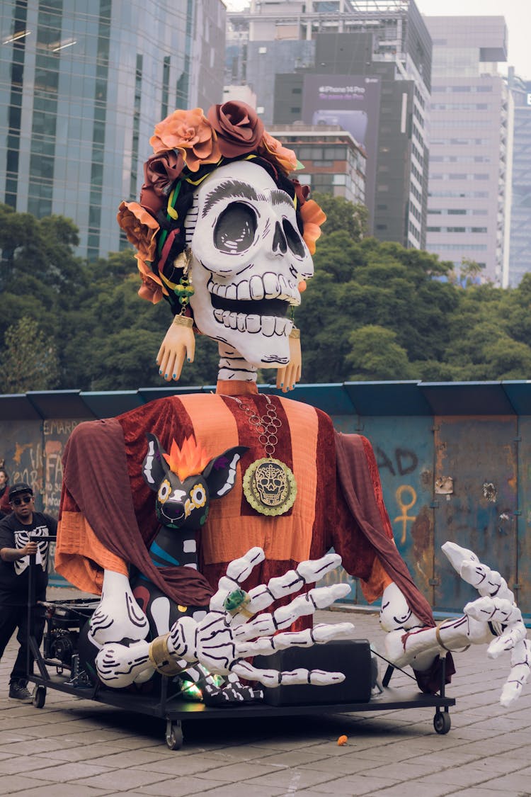 A Man Pushing A Giant Skeleton