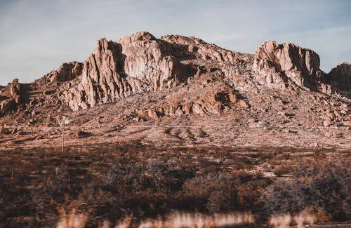 Brown Mountain under Blue Sky