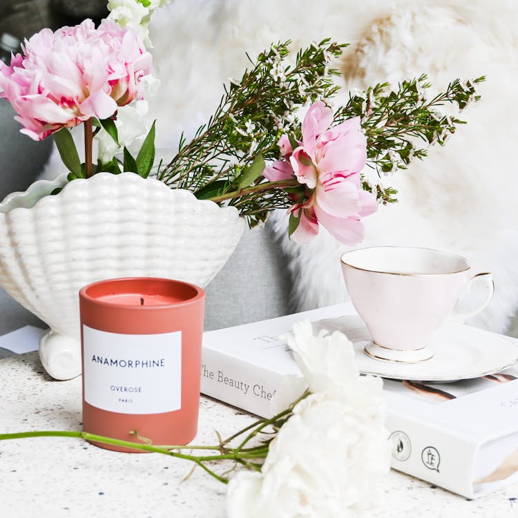 Candle And Flowers On A Table 