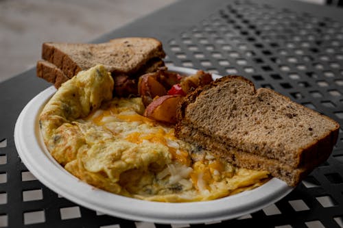 Free Photo of a Plate with Scrambled Eggs and Bread Stock Photo