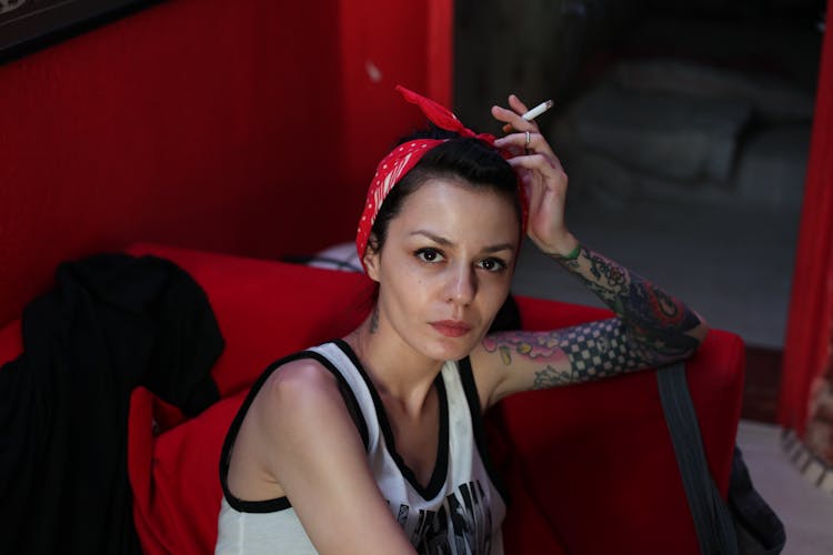 Portrait Of Woman In Red Headband Smoking