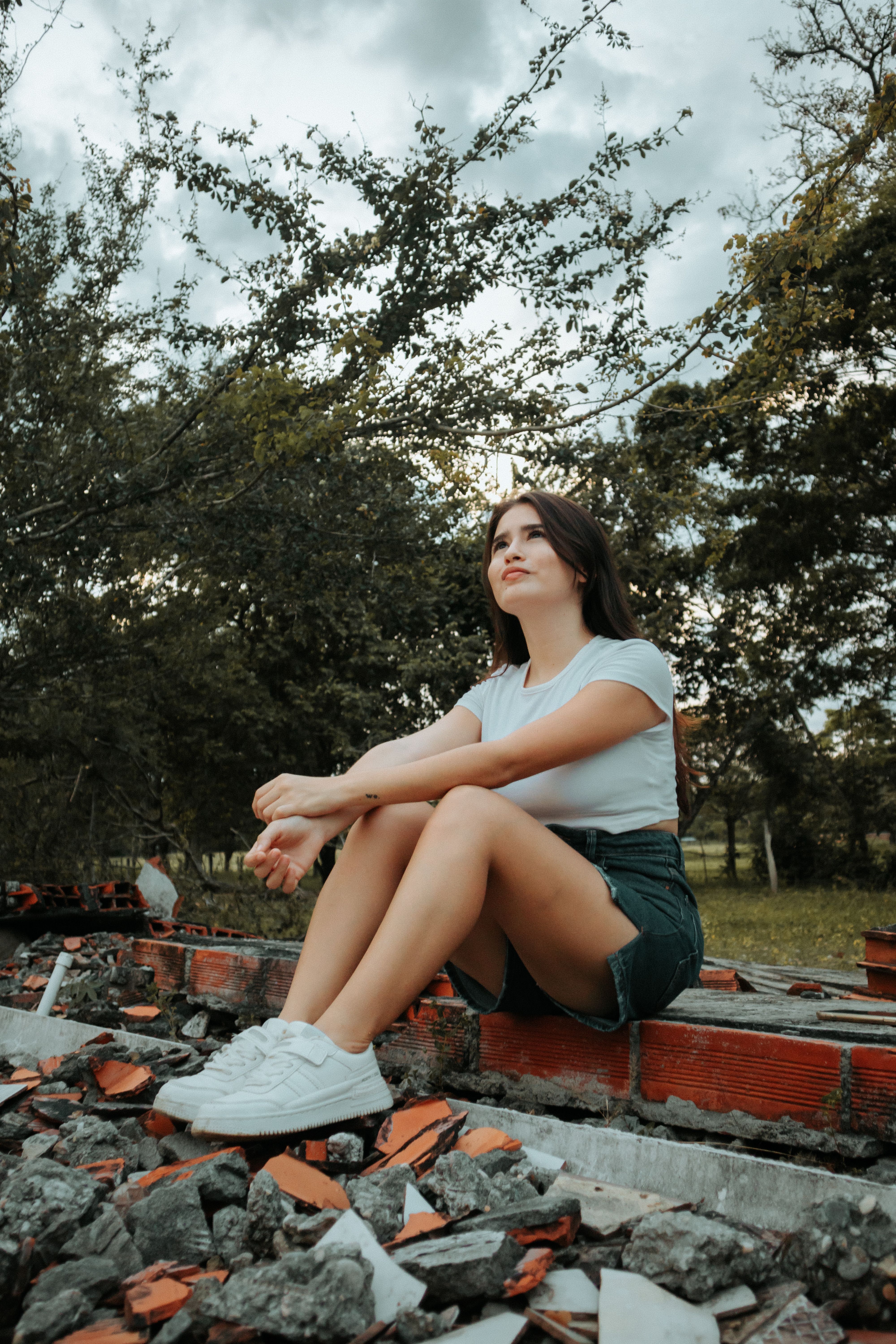 Portrait of a Woman Sitting on the Ground · Free Stock Photo