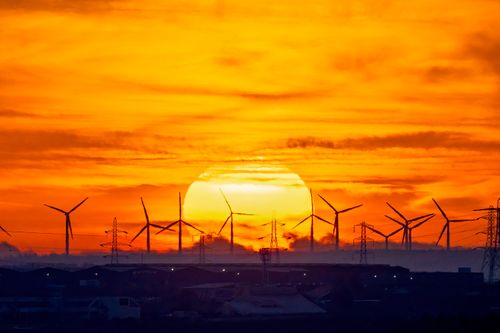Free Silhouette of wind turbines at sunset, showcasing sustainable energy solutions. Stock Photo
