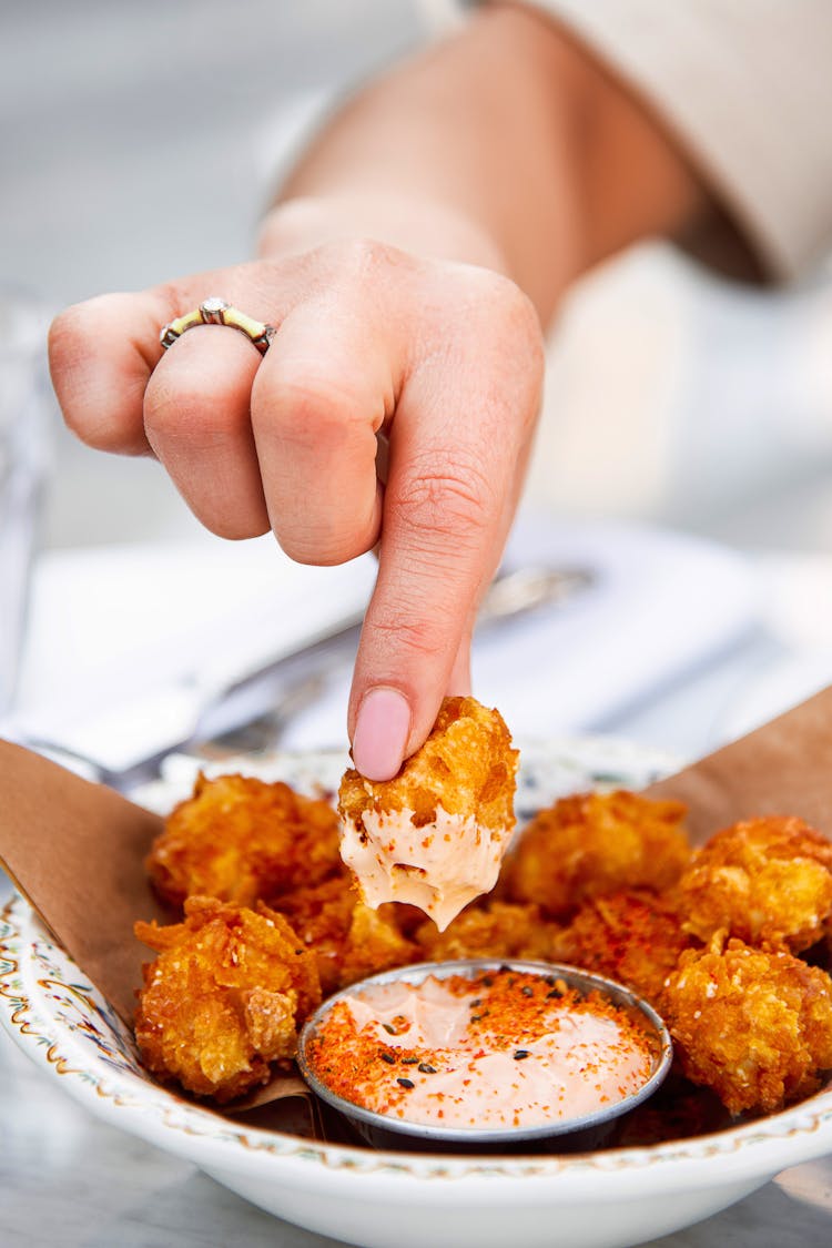 Dipping Fried Food In Sauce