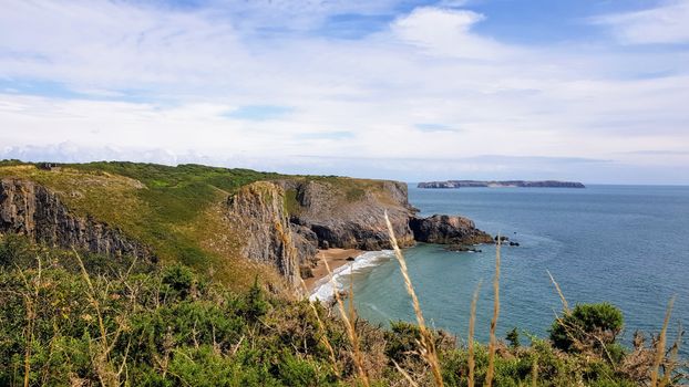 Scenic view of the dramatic cliffs and coast at Manorbier, Wales, perfect for nature enthusiasts.