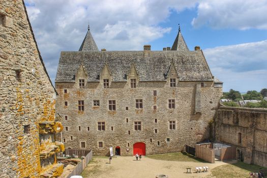 Facade of a Stone Castle with a Red Door