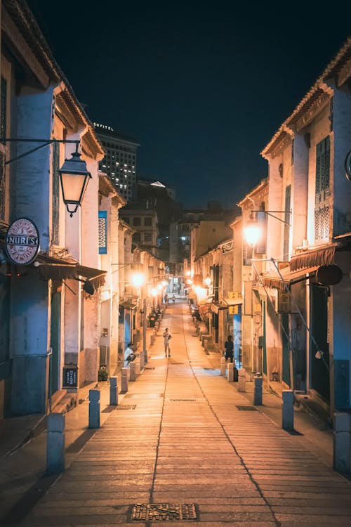 People Walking on the Street at Night