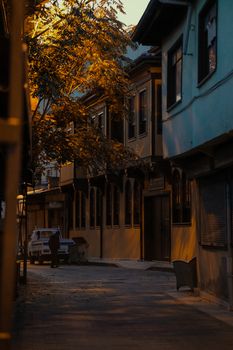 Quiet vintage street in warm evening light, evoking a retro residential atmosphere.