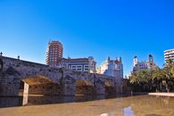 Scenic view of Pont de la Mar bridge and urban architecture in Valencia, Spain.