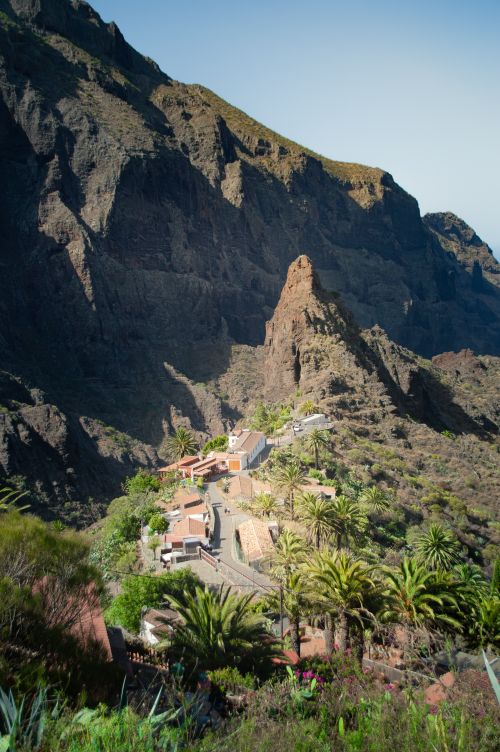 Free A scenic view of a secluded village nestled in the rocky landscapes of Tenerife. Stock Photo