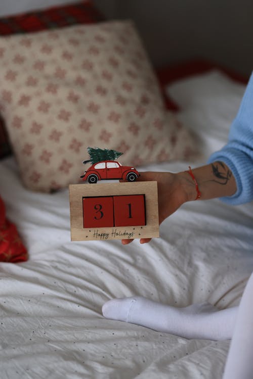 Hand Holding Wooden New Year Box