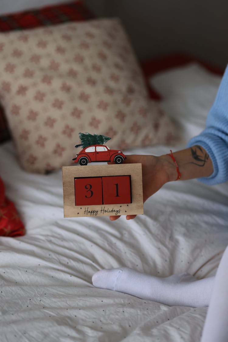 Hand Holding Wooden New Year Box