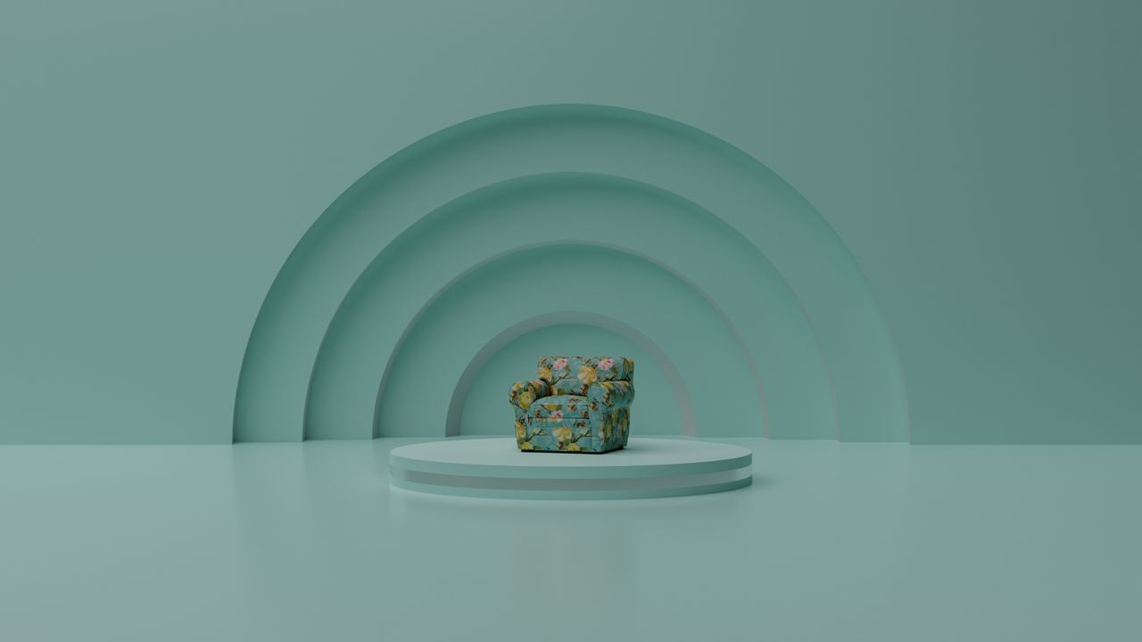 floral chair on a platform in a minimalist turquoise space