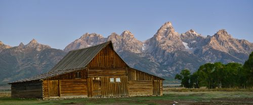 Free Iconic wooden barn with Grand Teton backdrop in Jackson, Wyoming. Stock Photo