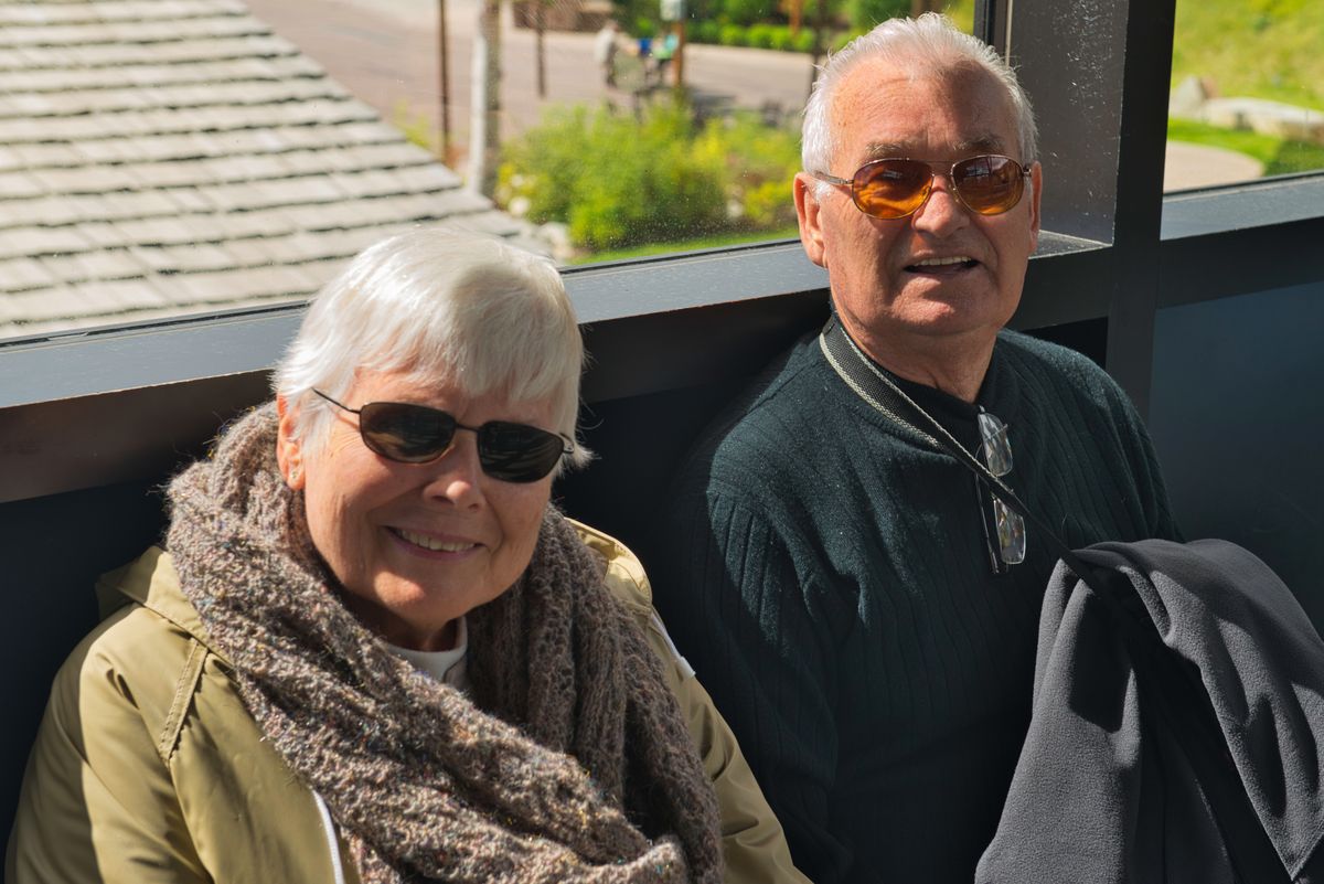 Happy senior couple in sunglasses enjoying a sunny day of travel