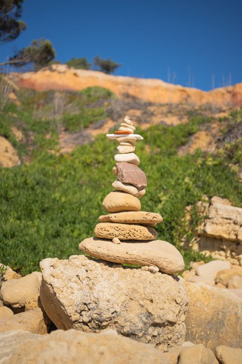 Stones Stack near Rock Formation · Free Stock Photo