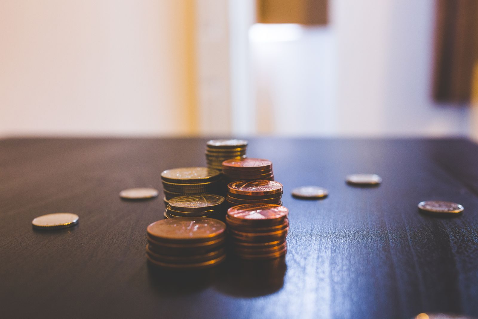 Stacked coins representing savings on software costs