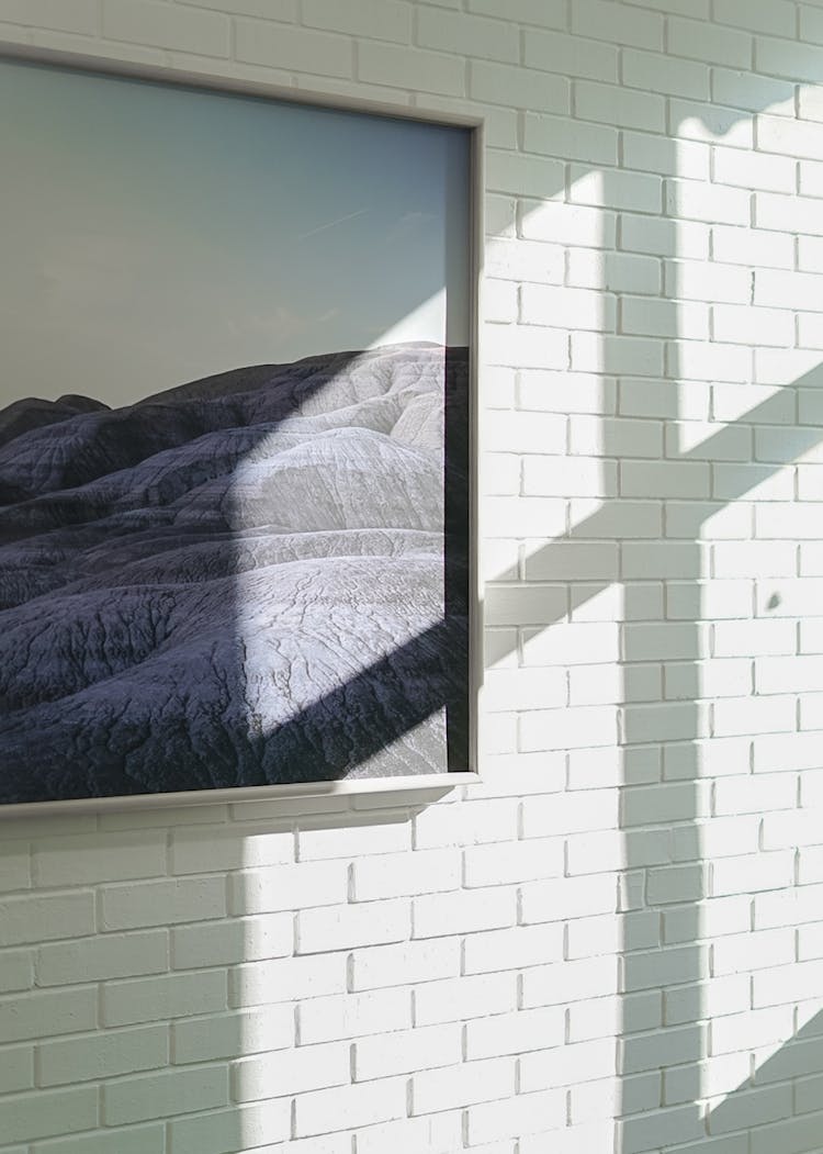 Shadow On Brick Wall With Painting