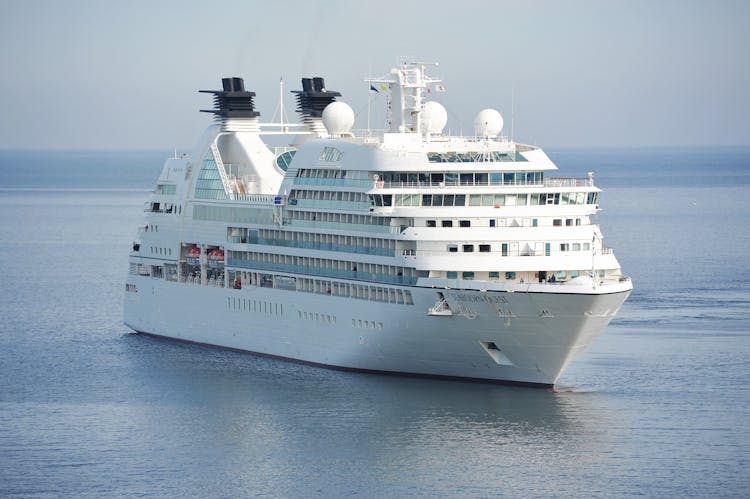 White Cruise Ship On Blue Body Of Water During Daytime