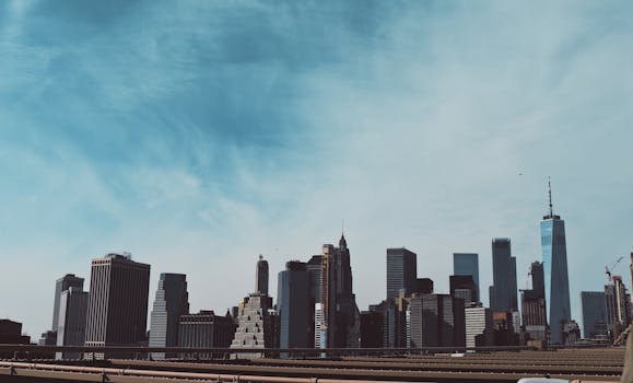 Stunning skyline view of New York City featuring iconic skyscrapers under a clear blue sky.