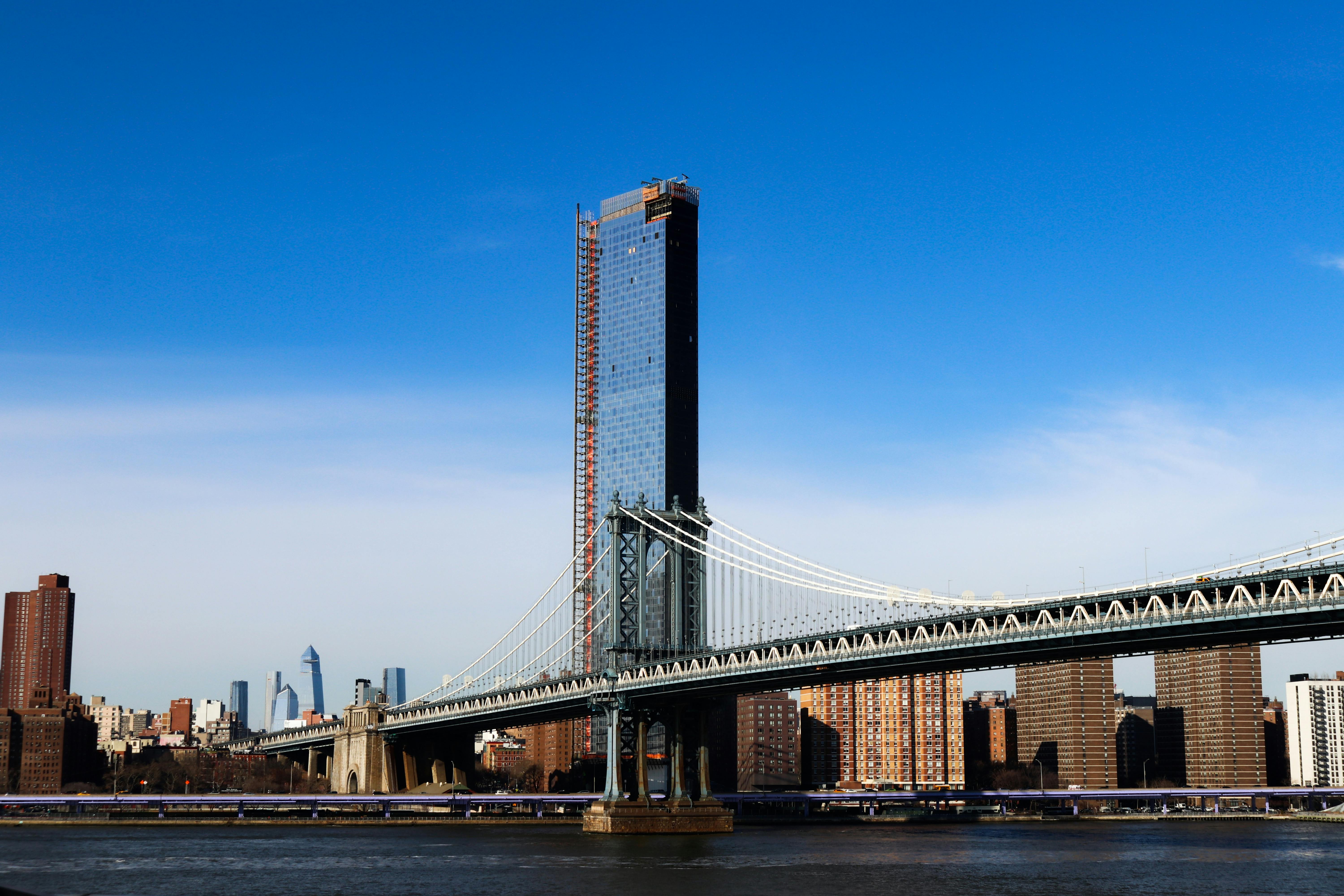 brown bridge under blue sky