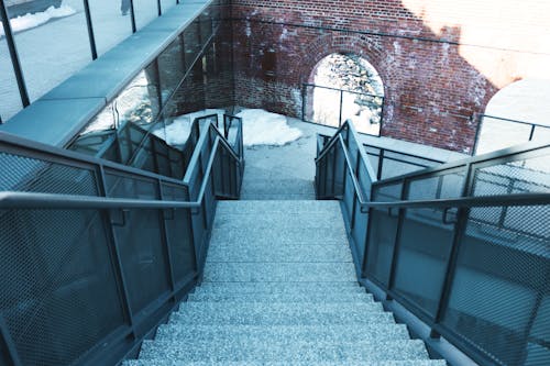 Brown Brick Wall With Black Metal Railings