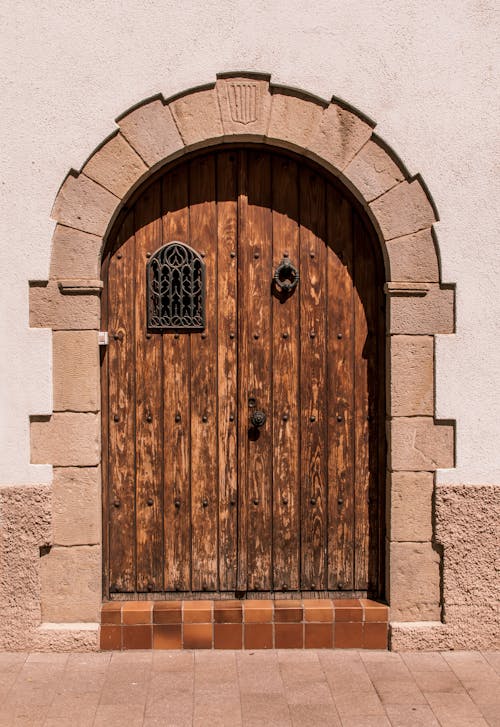 A Wooden Door Between the Concrete Wall