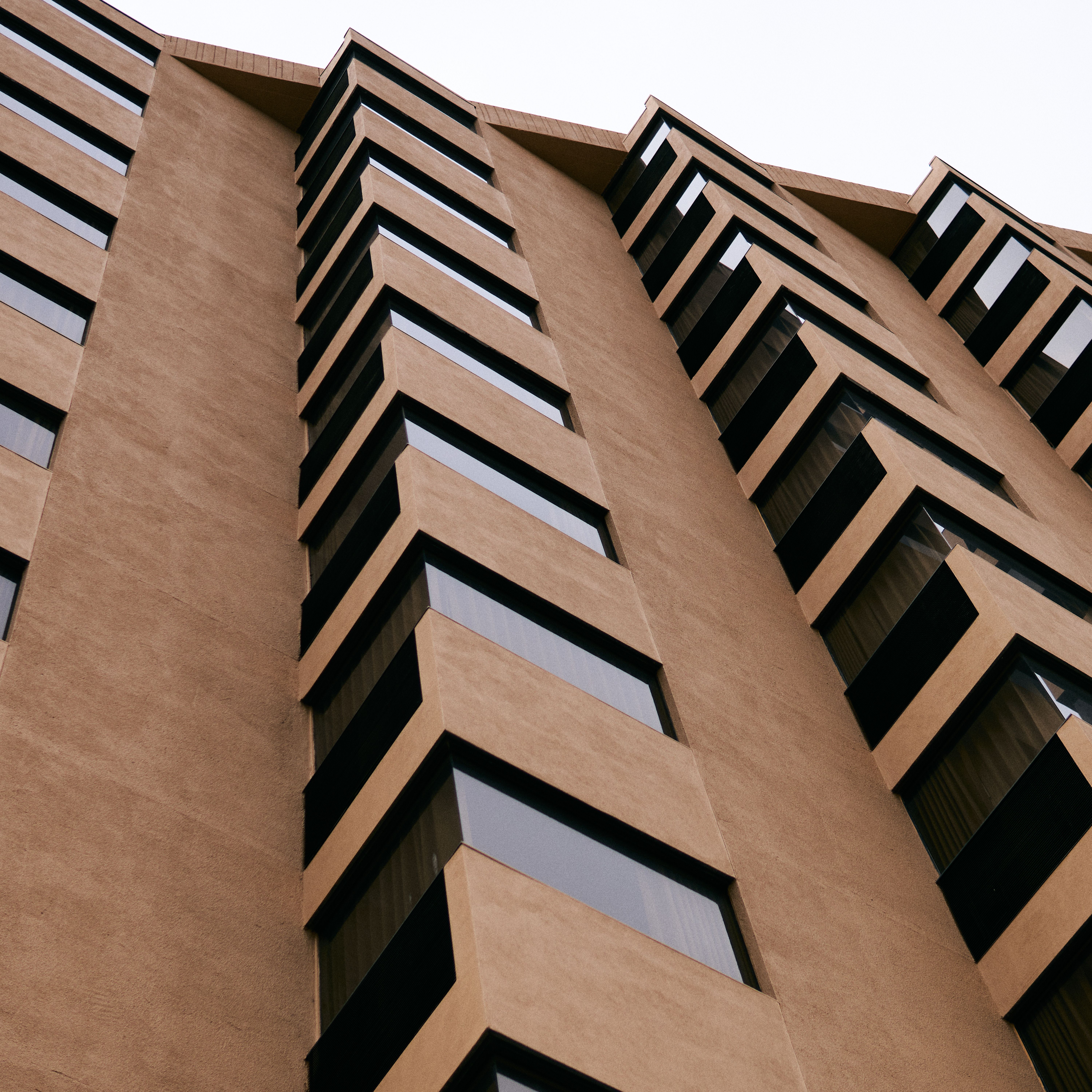 Low Angle Shot of a Brown Modern Building in Perspective