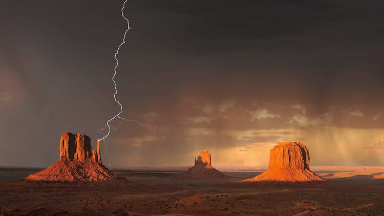 Grand Canyon Under Black Sky With Lightning During Daytime