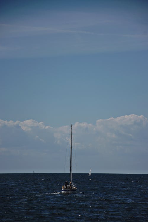 Sailboat on Sea Under Blue Sky