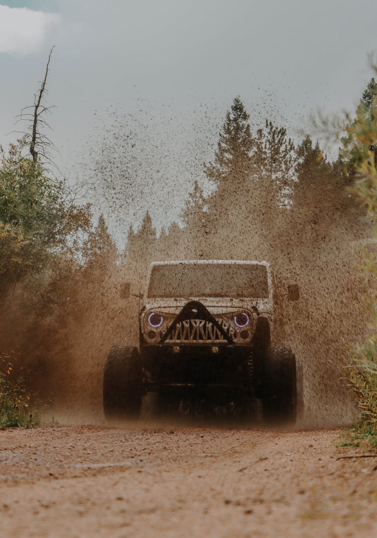 Jeep Wrangler Driving In Mud In A Forest