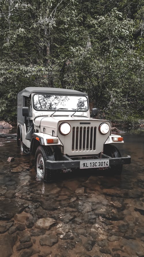 A 4x4 Car on a Rocky River