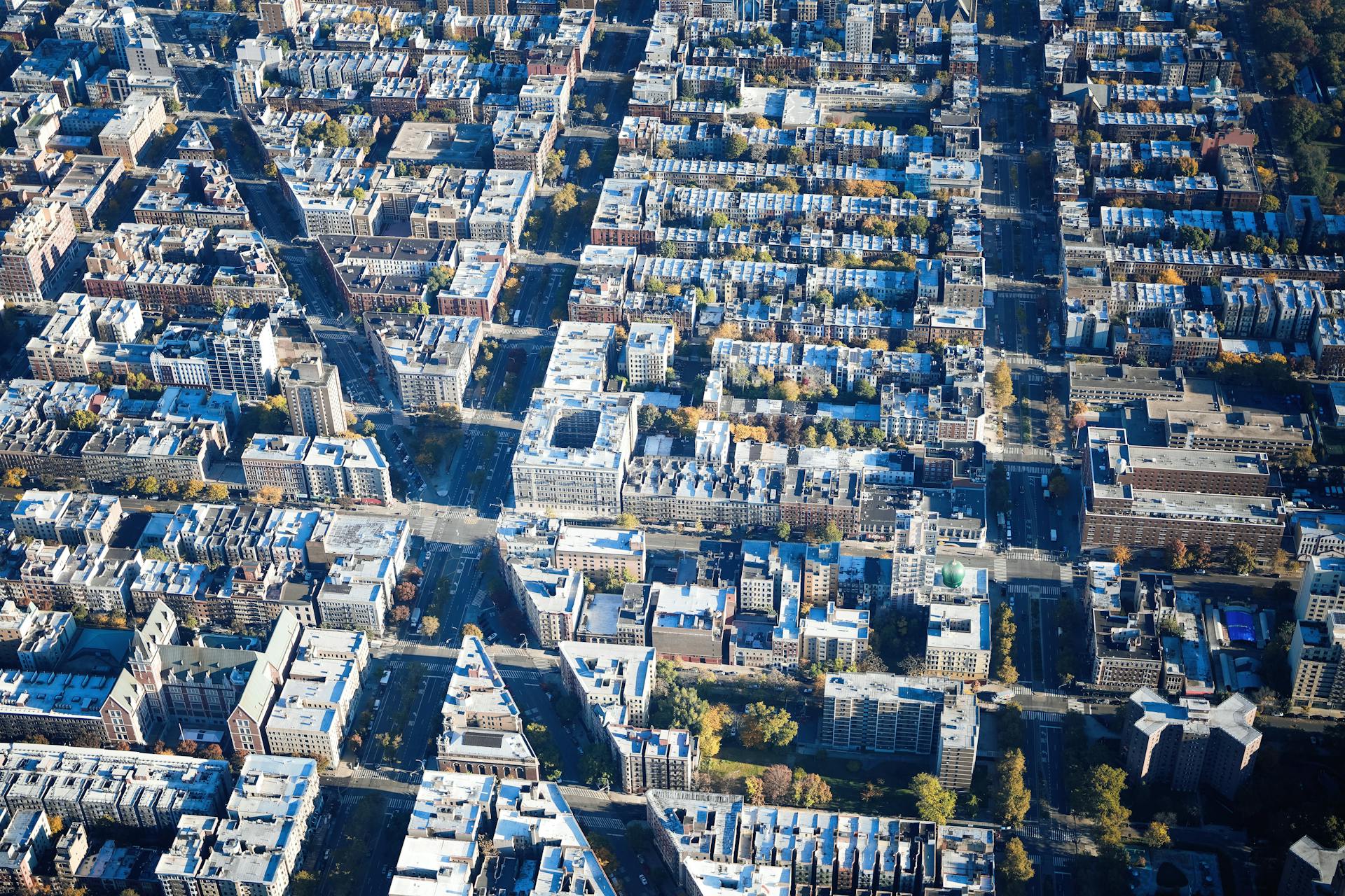 High-altitude view showcasing a structured urban grid layout under daylight.