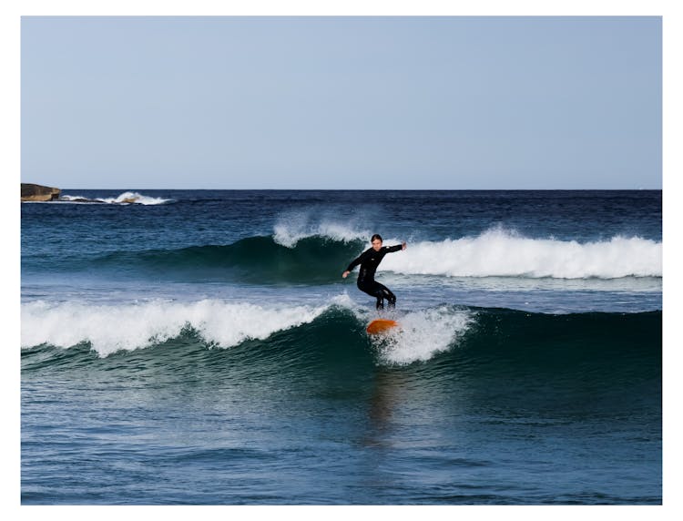 Photo Of A Man Surfing Sea Waves