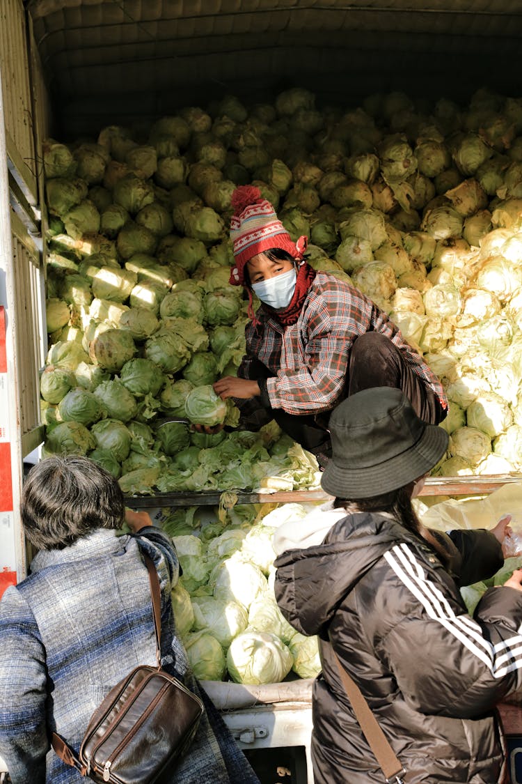 Woman Selling Cabbages From A Car Boot