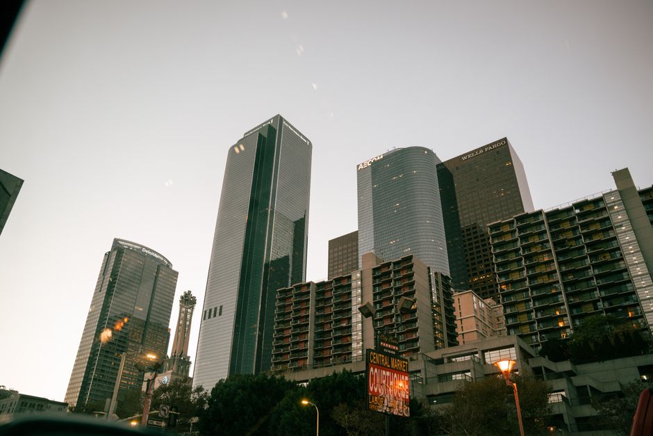 Low angle view of Los Angeles skyscrapers with a clear sky at dusk.