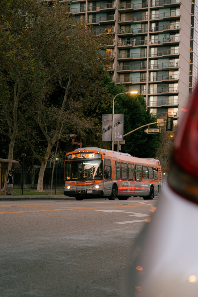 Bus Driving On Street In City