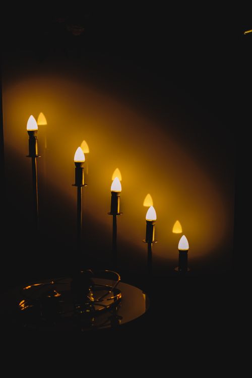 Free Elegant candlestick arrangement creating a warm, romantic atmosphere. Stock Photo