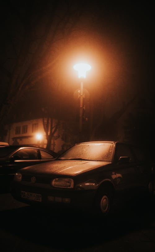 Photo of Car parked Near a Street Light