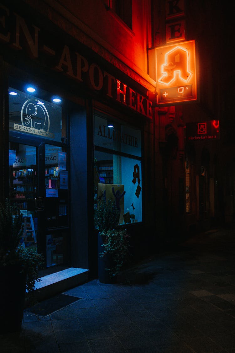 Facade Of A Closed Pharmacy At Night