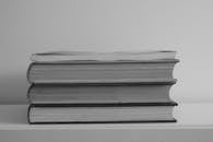 Stack of Books on White Table
