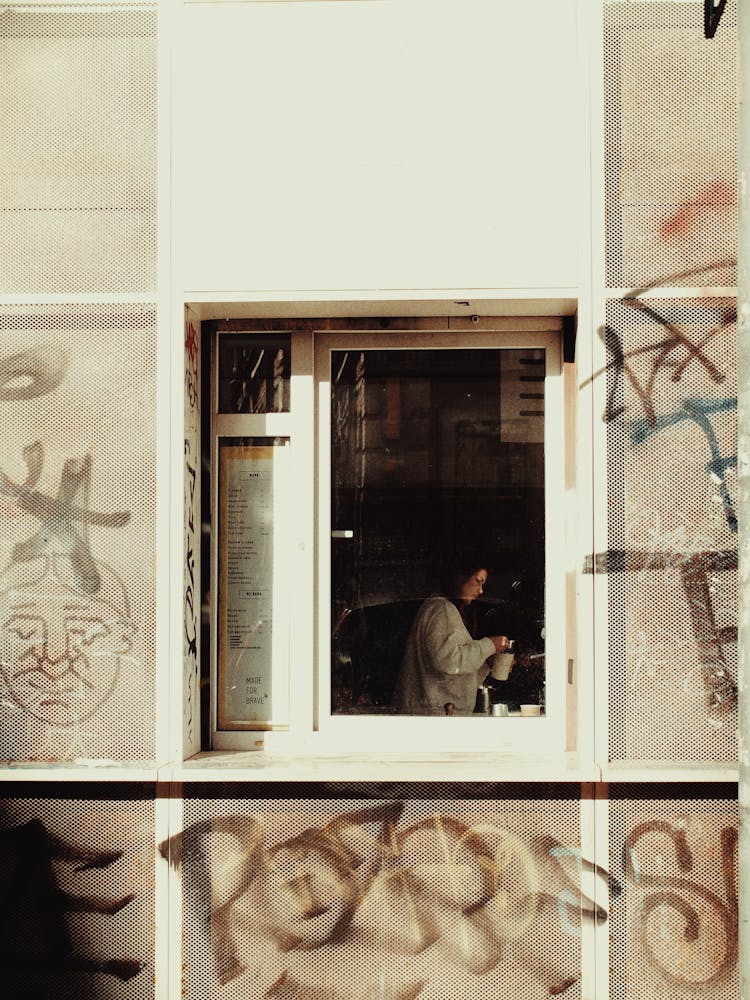 Woman In Building Window