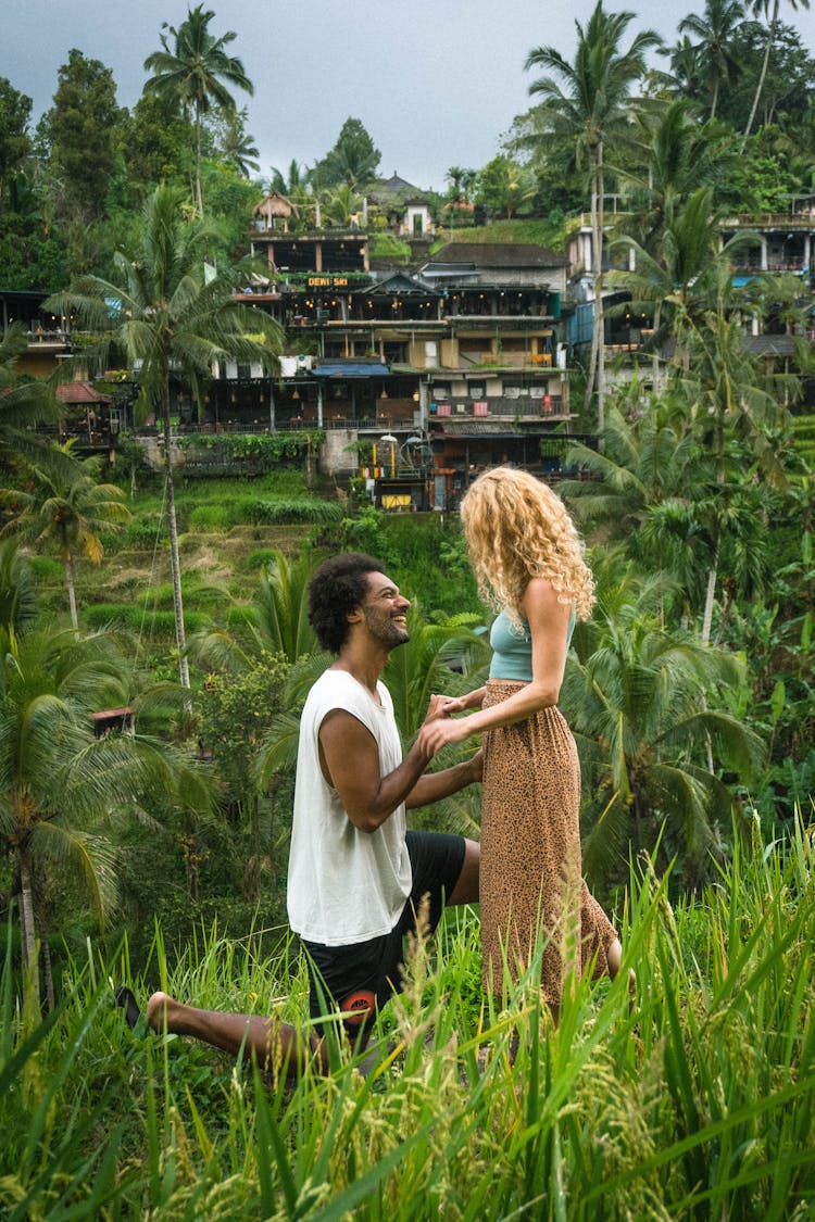 Man Proposing To A Woman In The Field 